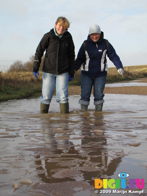 SX11261 Lib and Jenni paddling in icy puddle